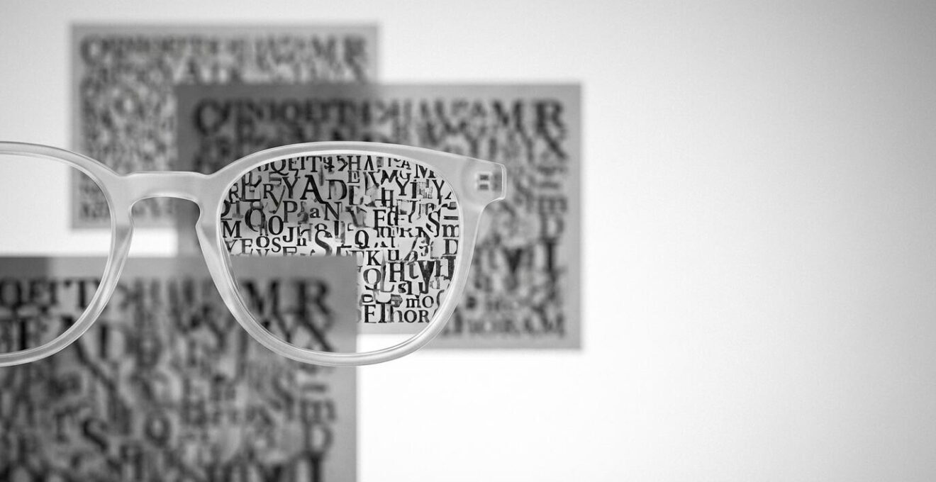 Professional photograph showing multiple focal points represented through selective focus layers of text at different depths