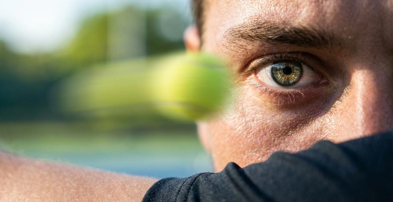 Tennis player's eye tracking a fast-moving ball showing dynamic visual acuity