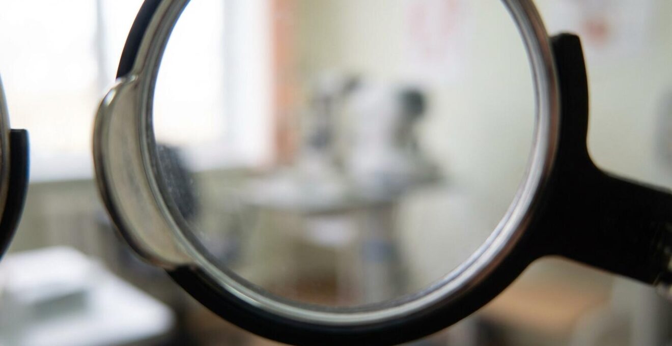 Patient's view during eye exam showing optometry equipment from unique angle