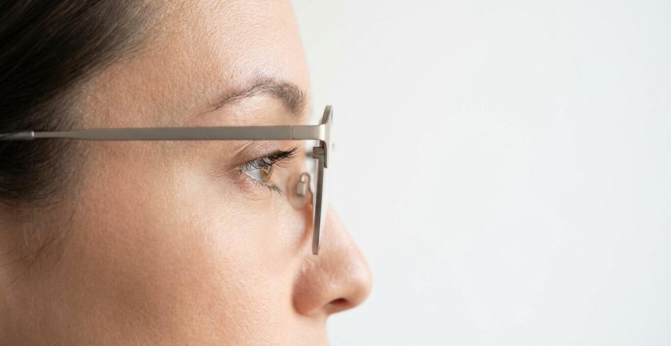 Side profile showing vertex distance between glasses and eye versus contact lens on eye